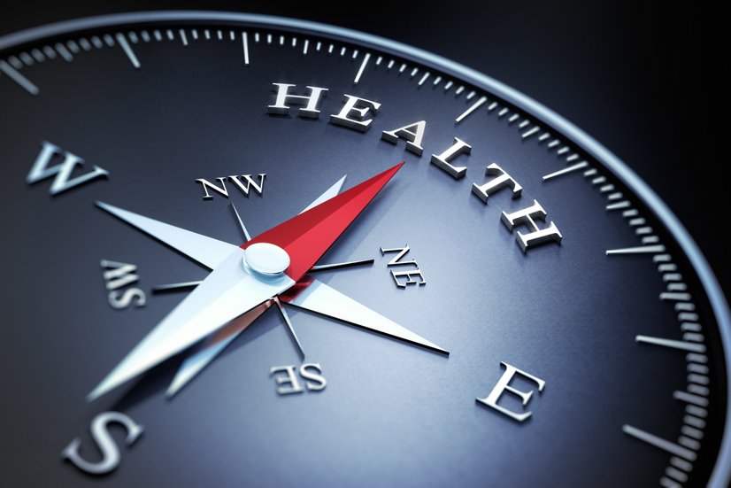 Kompass mit roter Nadel zeigt auf das Wort „Health“